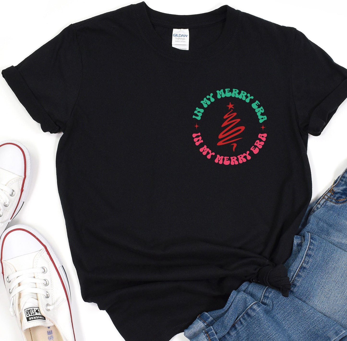 a black t - shirt with a christmas tree on it