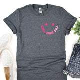 a women's t - shirt with the word mom on it next to a