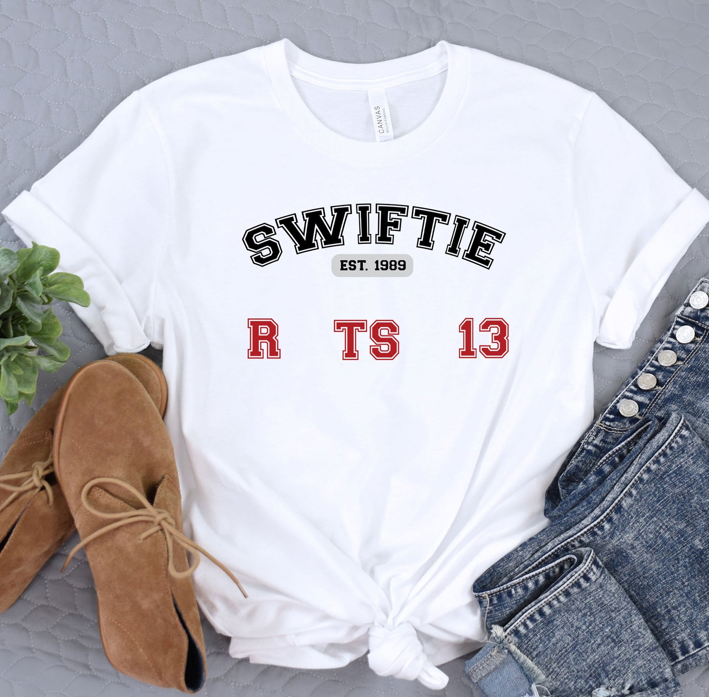 a white t - shirt with the words swiffie next to it