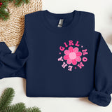 a blue sweatshirt with a pink flower on it