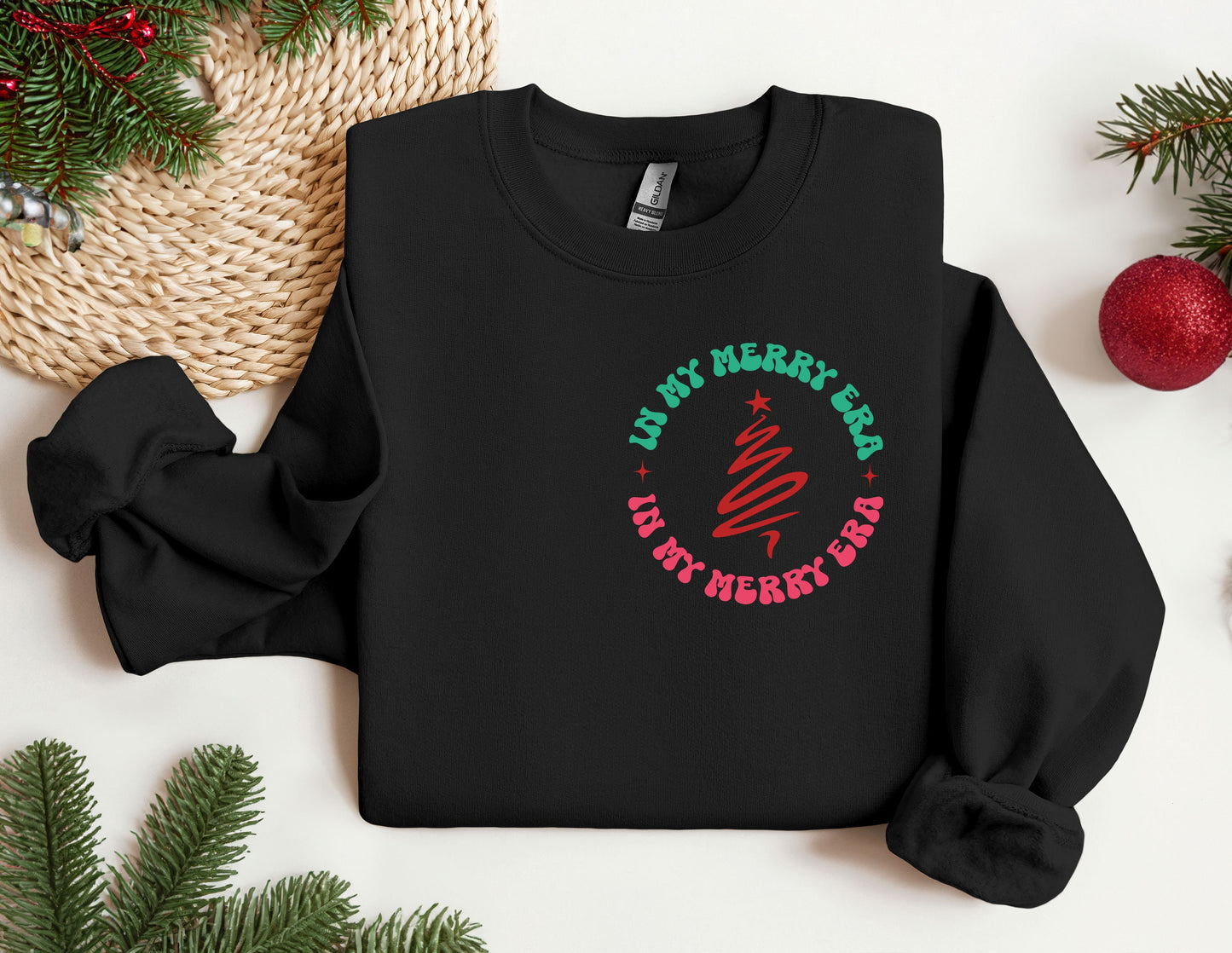 a black sweatshirt with a red and green design on it