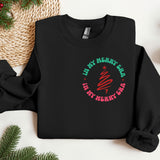 a black sweatshirt with a red and green design on it