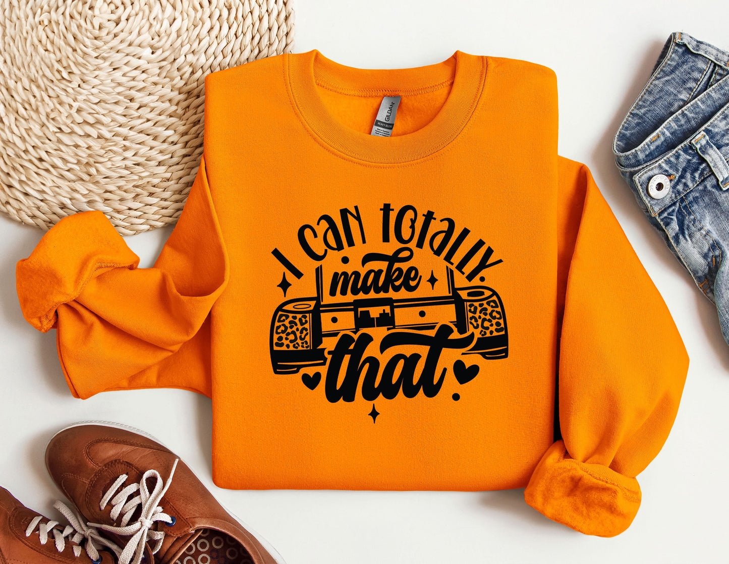 a pair of shoes and an orange sweatshirt with the words i can totally make that