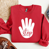 a red sweatshirt with a white stop sign on it