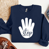 a blue sweatshirt with a white stop sign on it