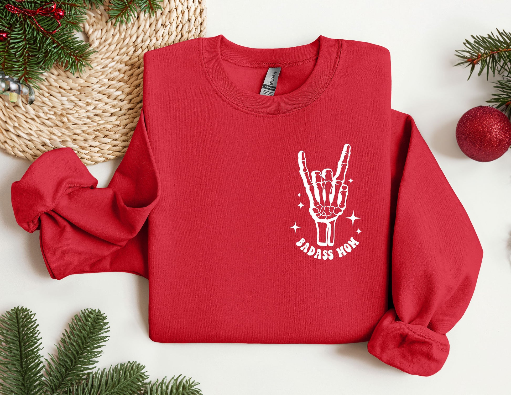 a red sweater with a peace sign on it