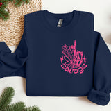 a blue sweatshirt with a pink design on it