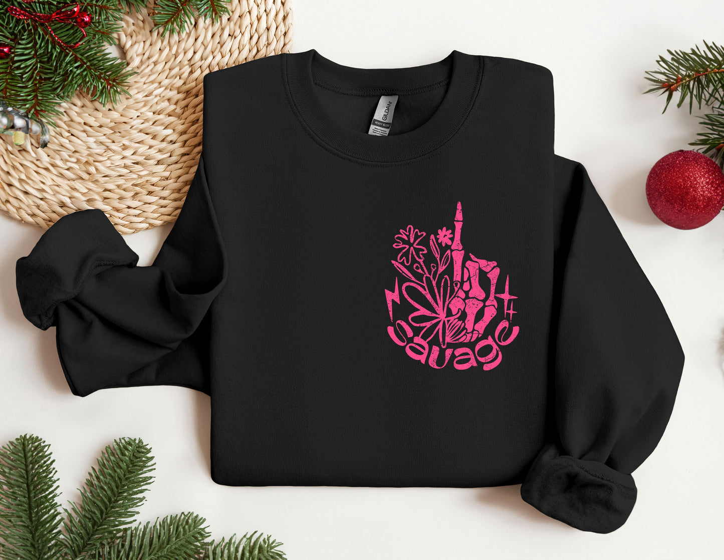 a black sweatshirt with a pink design on it