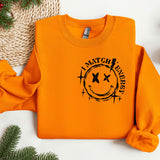 an orange sweatshirt with a smiley face on it