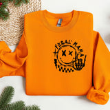 an orange sweatshirt with a picture of a person's hand on it
