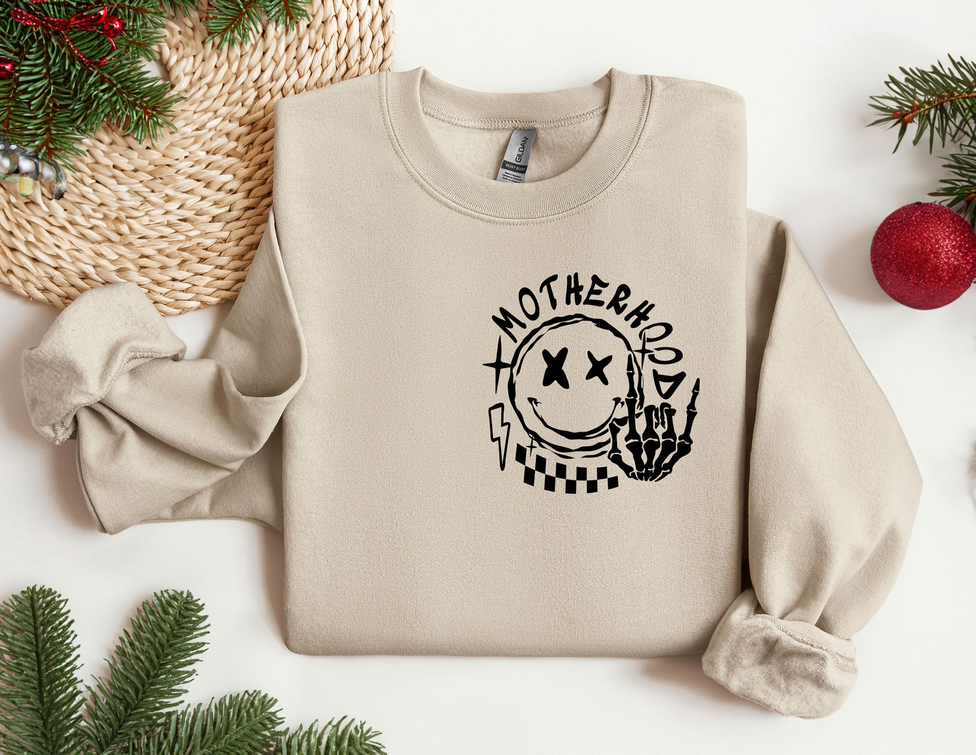 a sweatshirt with the words motherhood printed on it