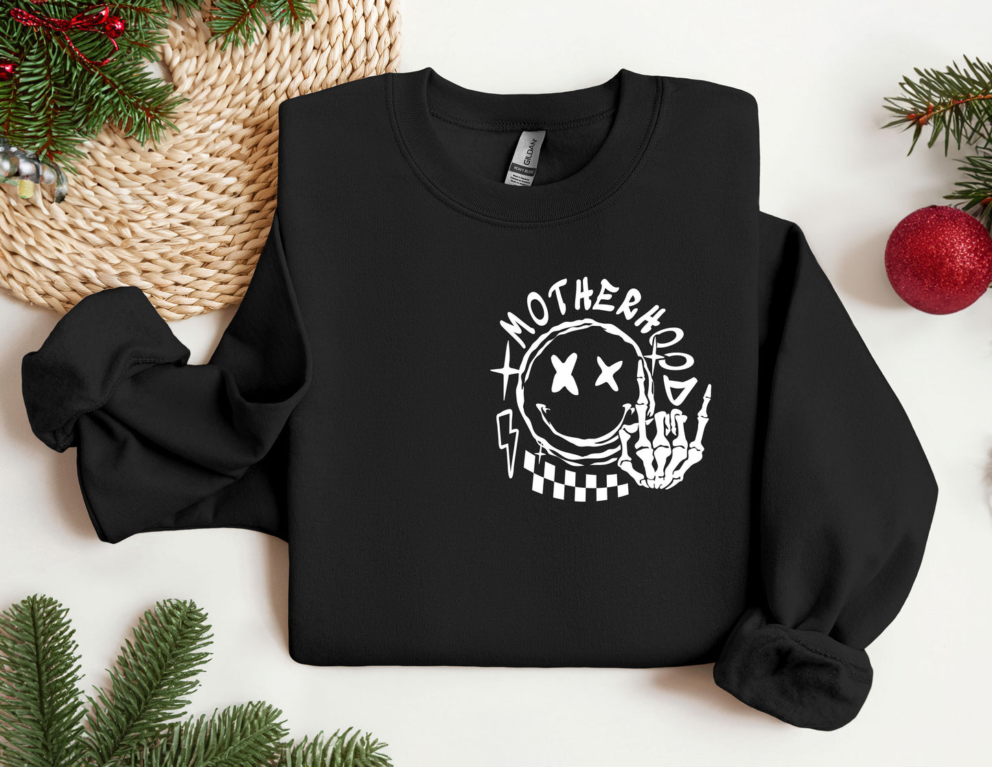 a black sweatshirt with the words motherhood printed on it