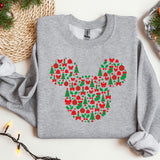 a mickey mouse christmas sweater on a table