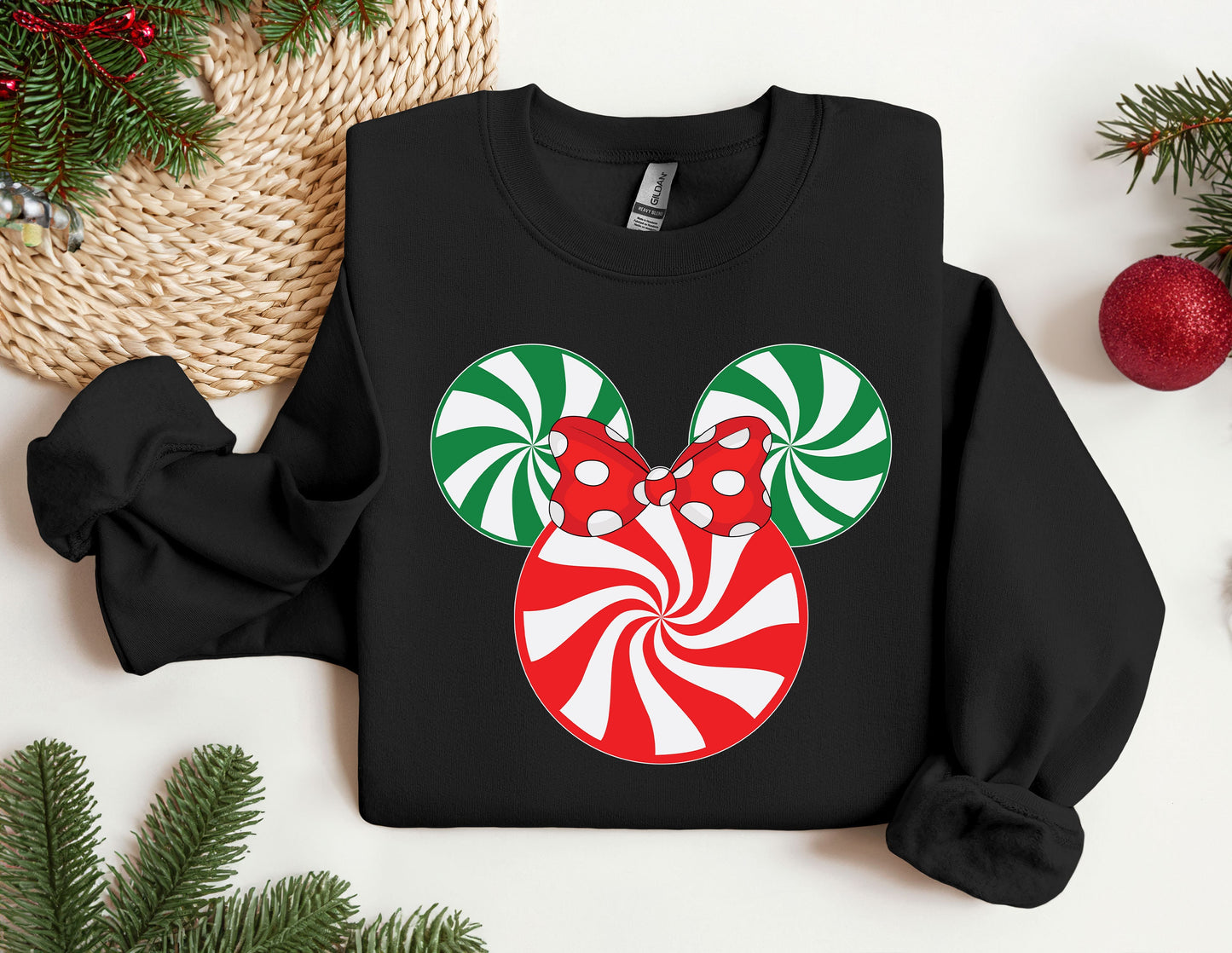 a mickey mouse christmas sweater with candy canes on it