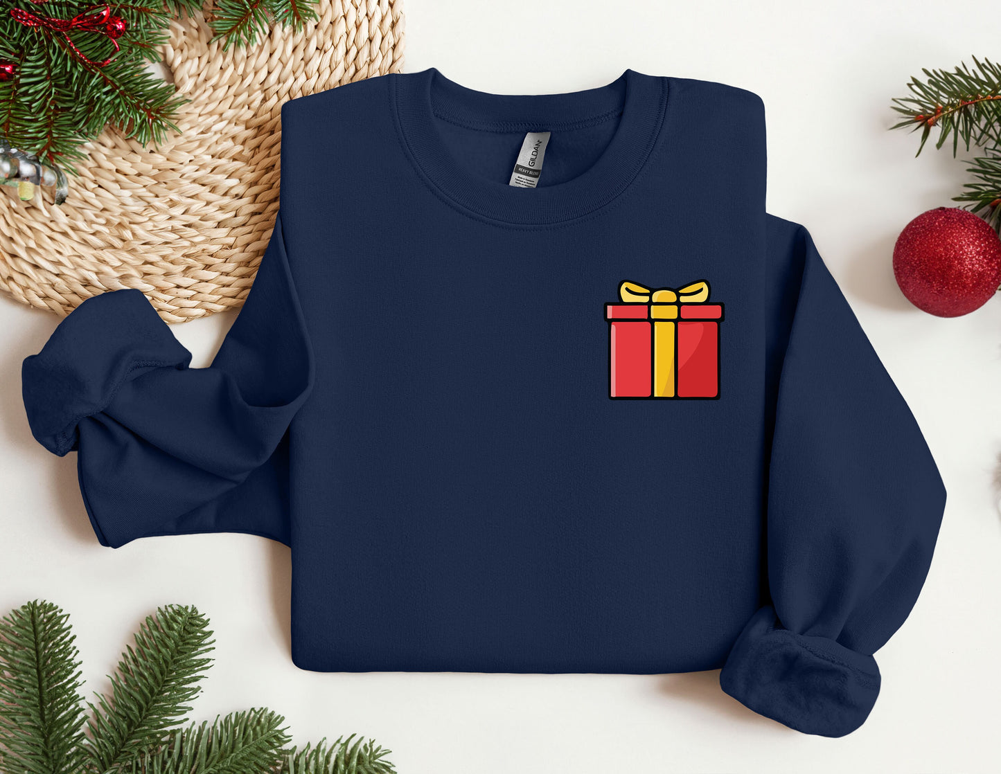 a blue sweater with a gift box on it