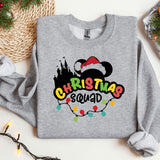 a mickey mouse christmas sweatshirt sitting on top of a table