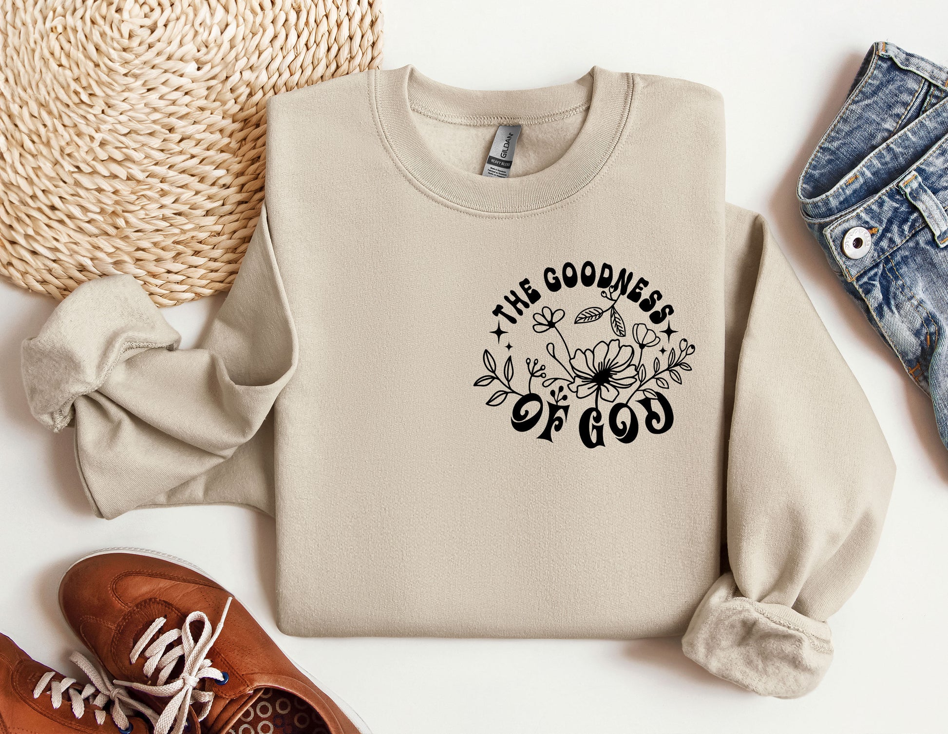 a sweater with the words the goodness of god printed on it