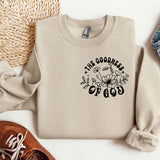 a sweater with the words the goodness of god printed on it