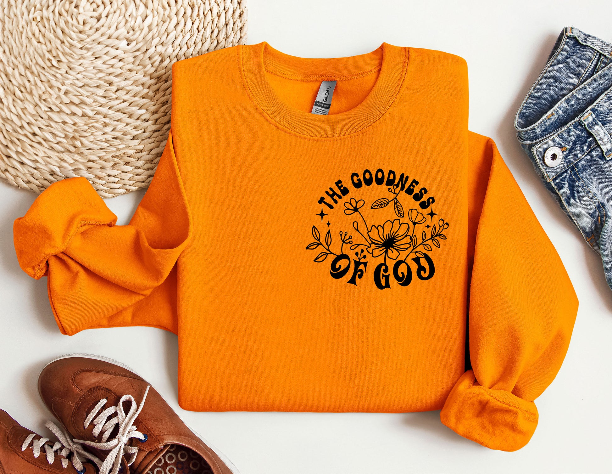 an orange sweatshirt with the words the goodness of god on it