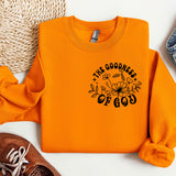 an orange sweatshirt with the words the goodness of god on it