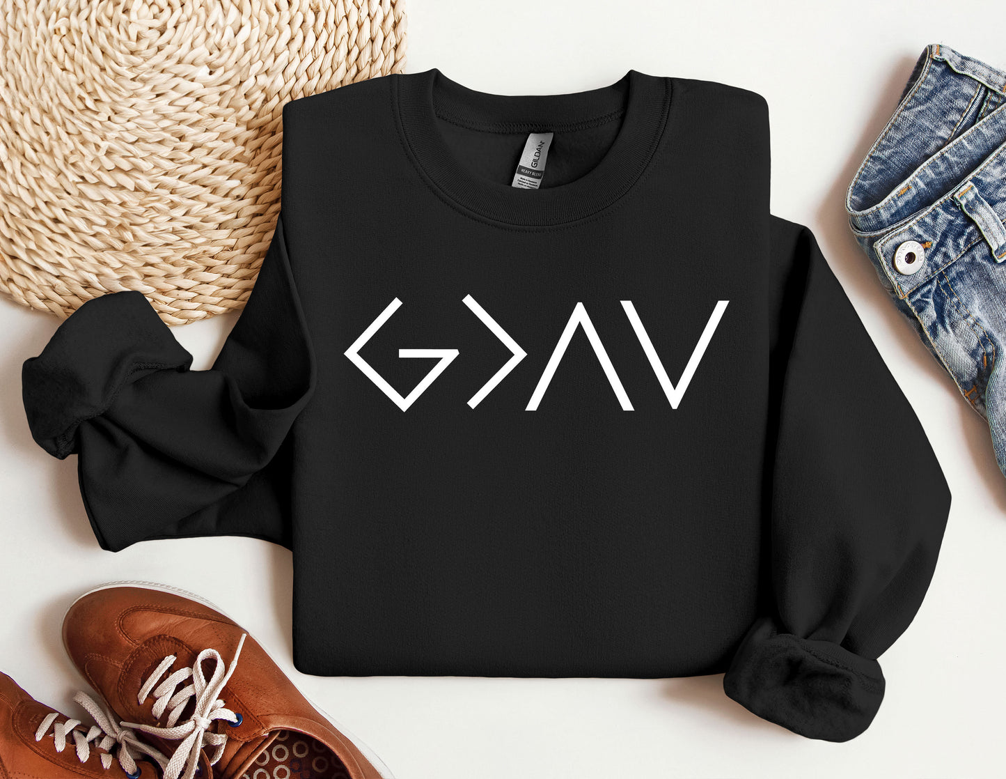 a black sweatshirt with the word gkg on it next to a pair of