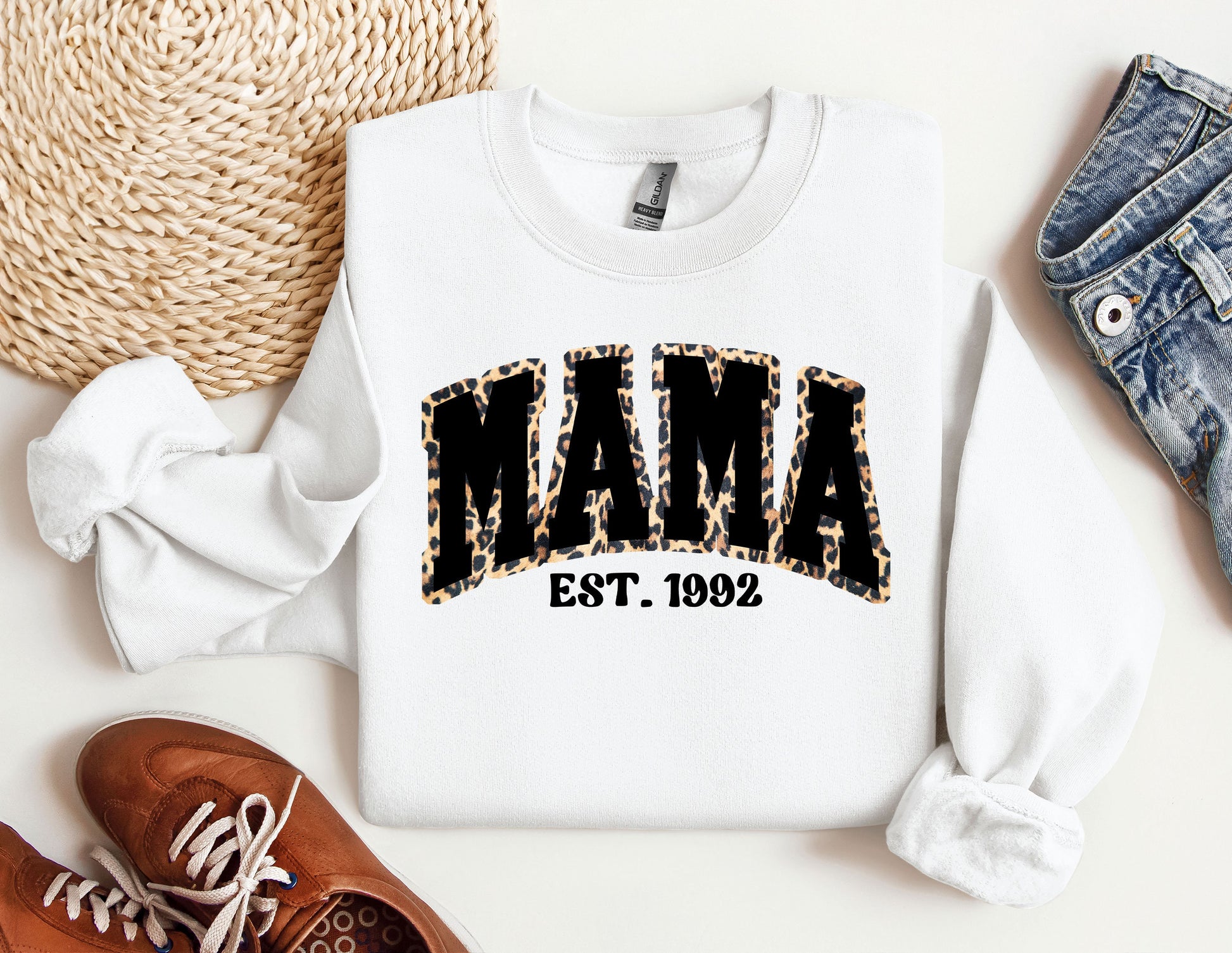 a white sweatshirt with the word mama printed on it