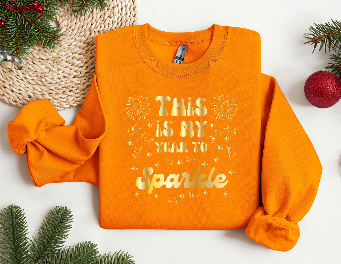 this is my year to sparkle sweatshirt on a table