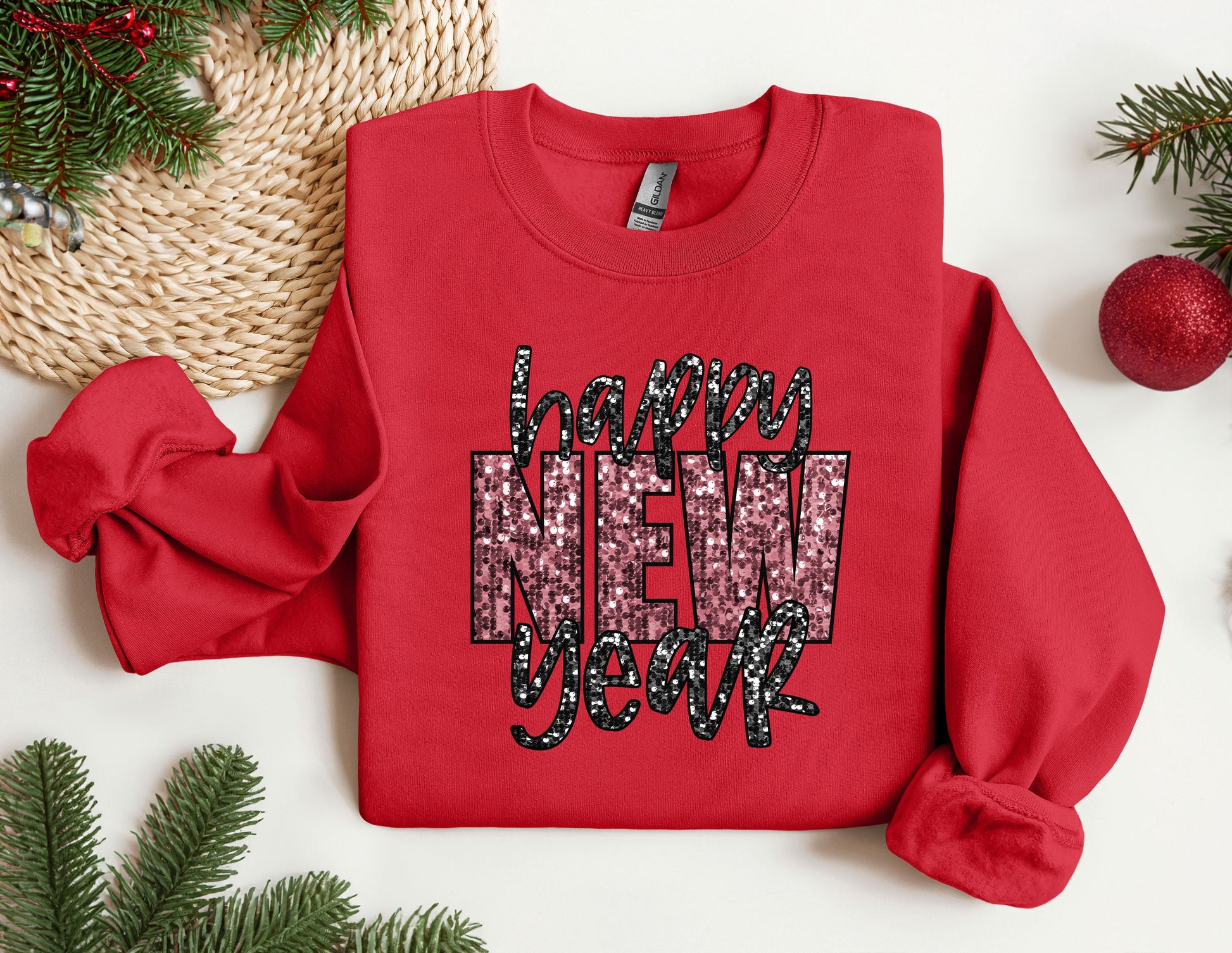 a red sweater with the words happy new year on it