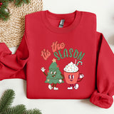 a red sweatshirt with a christmas tree and a cupcake on it
