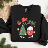a black sweatshirt with a christmas tree and a cupcake on it