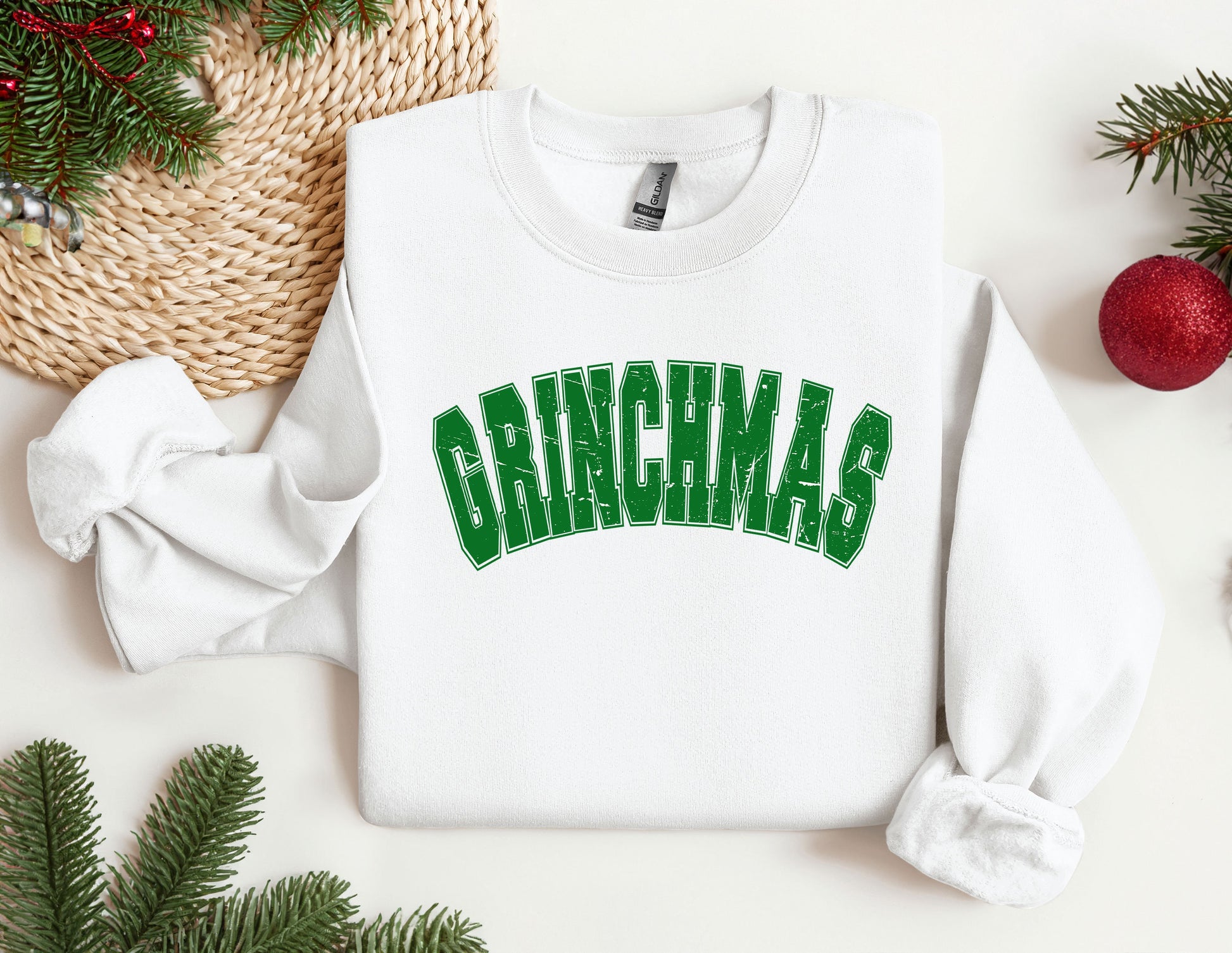 a white sweatshirt with the word grinnas printed on it