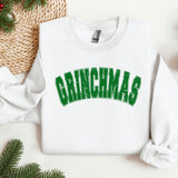 a white sweatshirt with the word grinnas printed on it