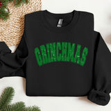 a black sweatshirt with the word grinnas printed on it
