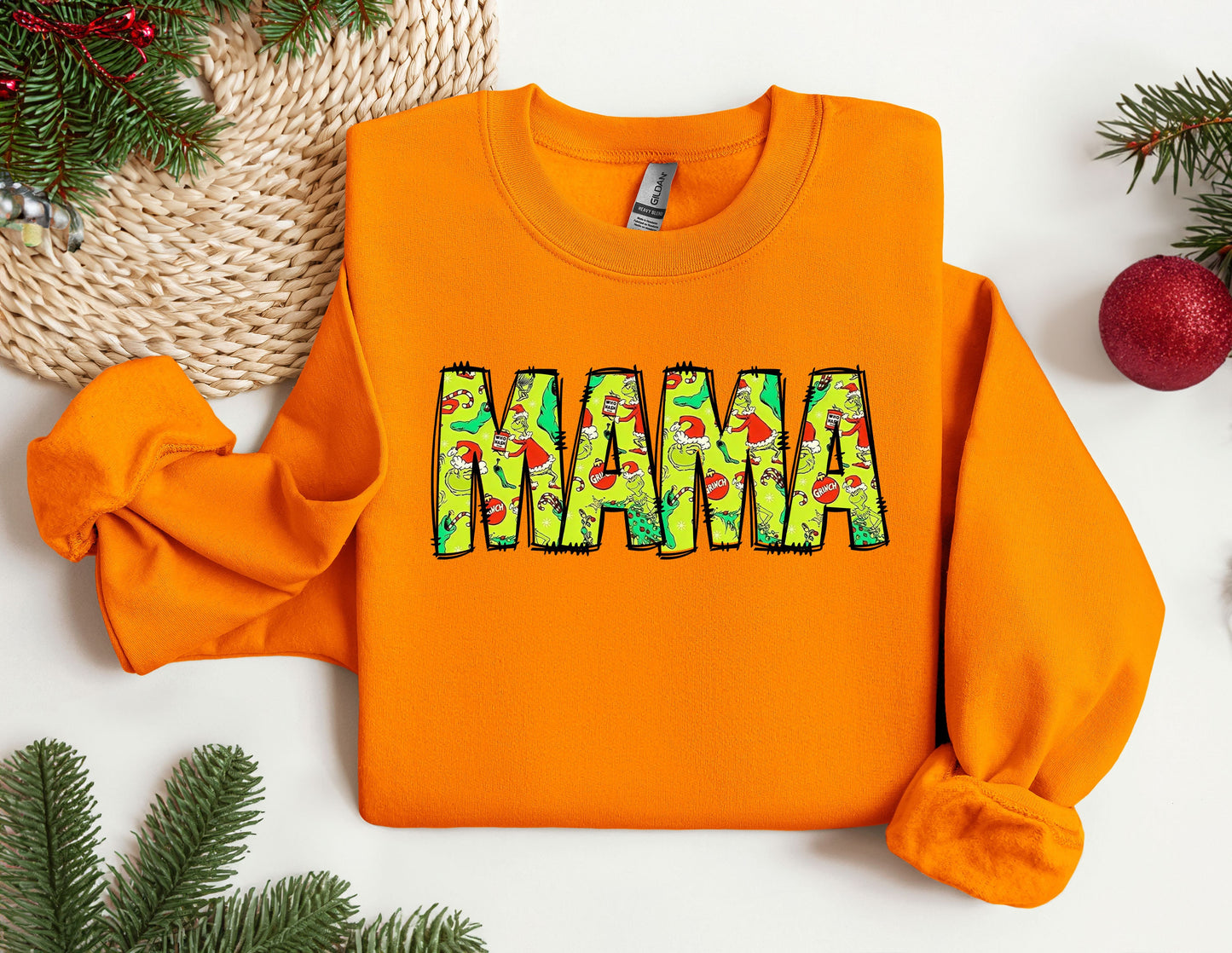 an orange sweatshirt with the word mama printed on it