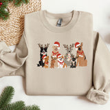 a group of dogs wearing christmas sweaters on top of a table