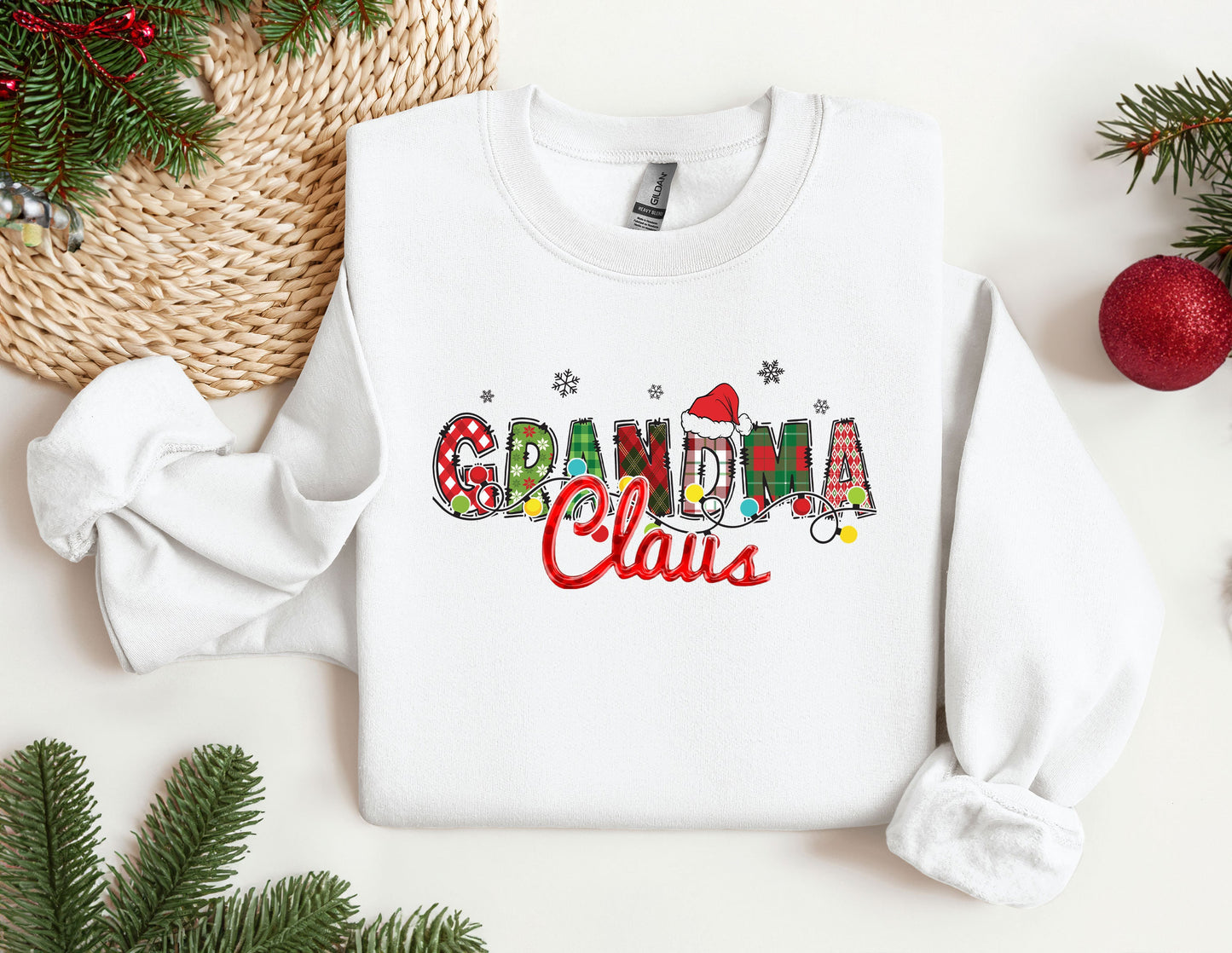 a white sweatshirt with the words grandma claus printed on it