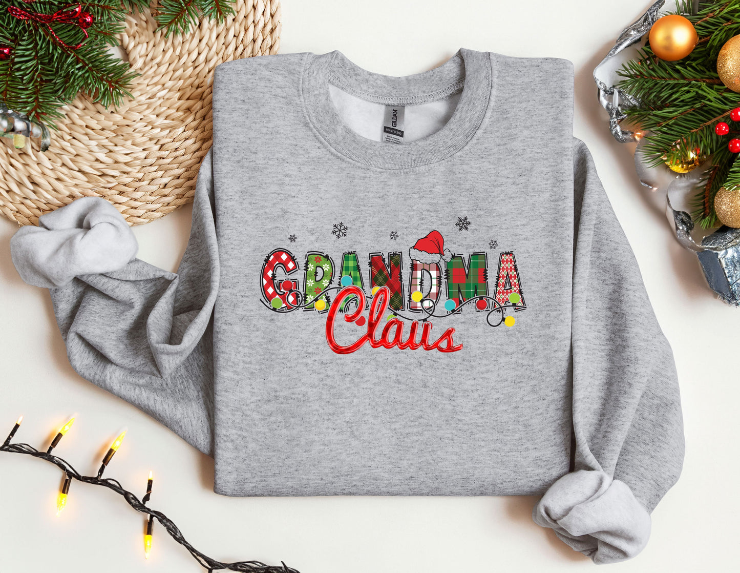 a gray sweatshirt with the words grandma claus on it