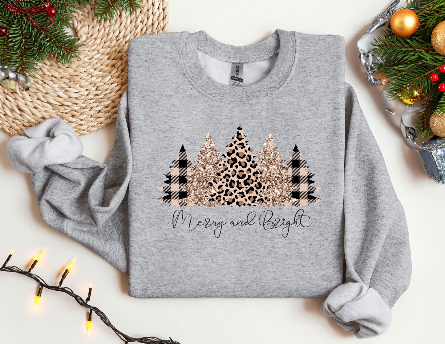 a sweater with a christmas tree and leopard print