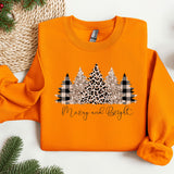 an orange sweater with a christmas tree on it