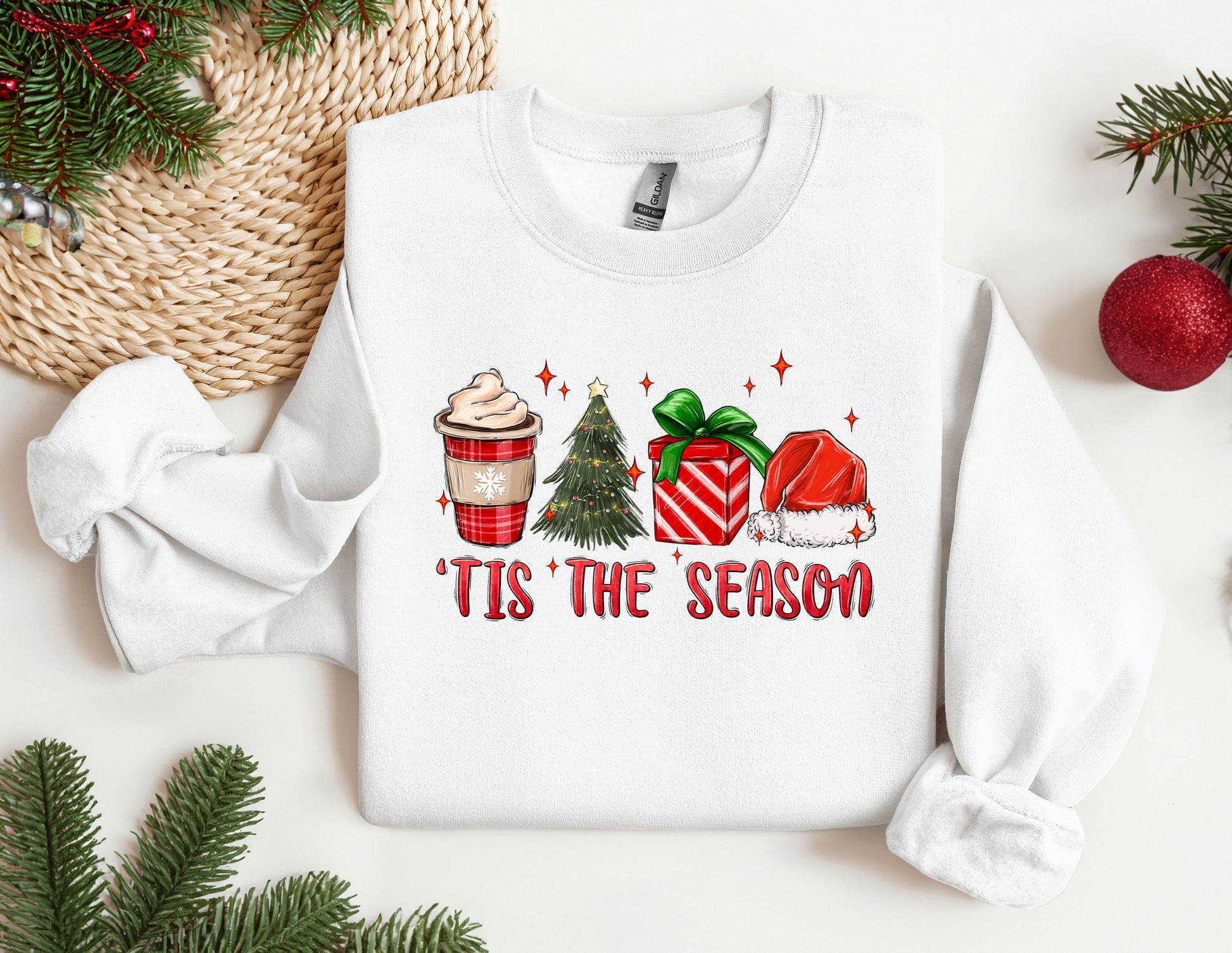 a white sweater with a christmas tree and presents on it