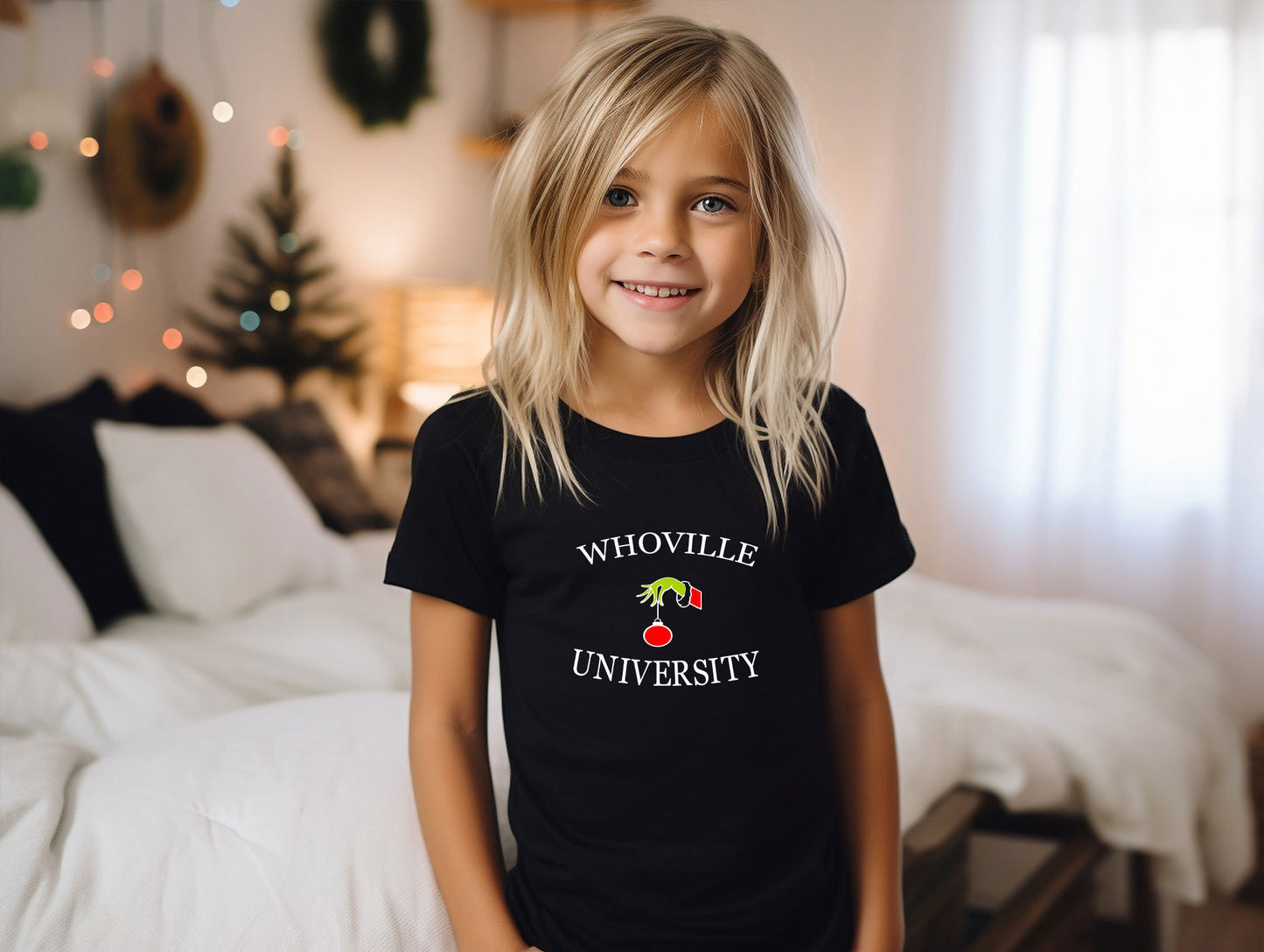 a little girl that is standing in front of a bed