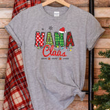 a t - shirt with the word mama claus on it next to a christmas tree