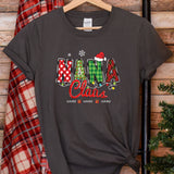 a t - shirt with the word santa claus on it next to a christmas tree