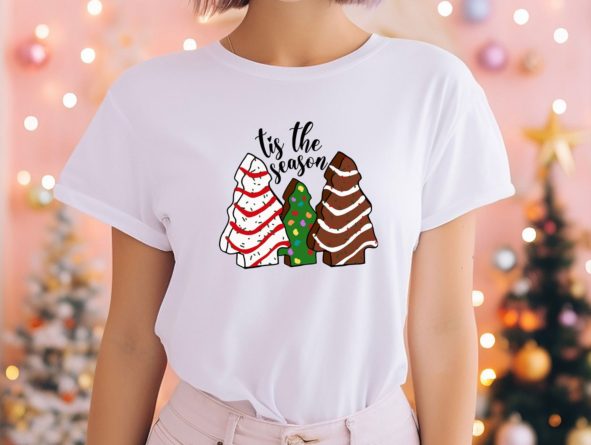 a woman wearing a t - shirt that says tis the season