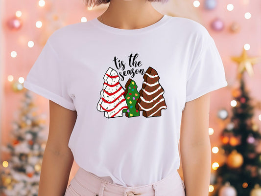 a woman wearing a t - shirt that says tis the season