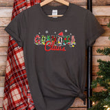 a t - shirt with the word grandma on it next to a christmas tree