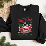a black christmas sweatshirt with mickey mouses tree farm on it