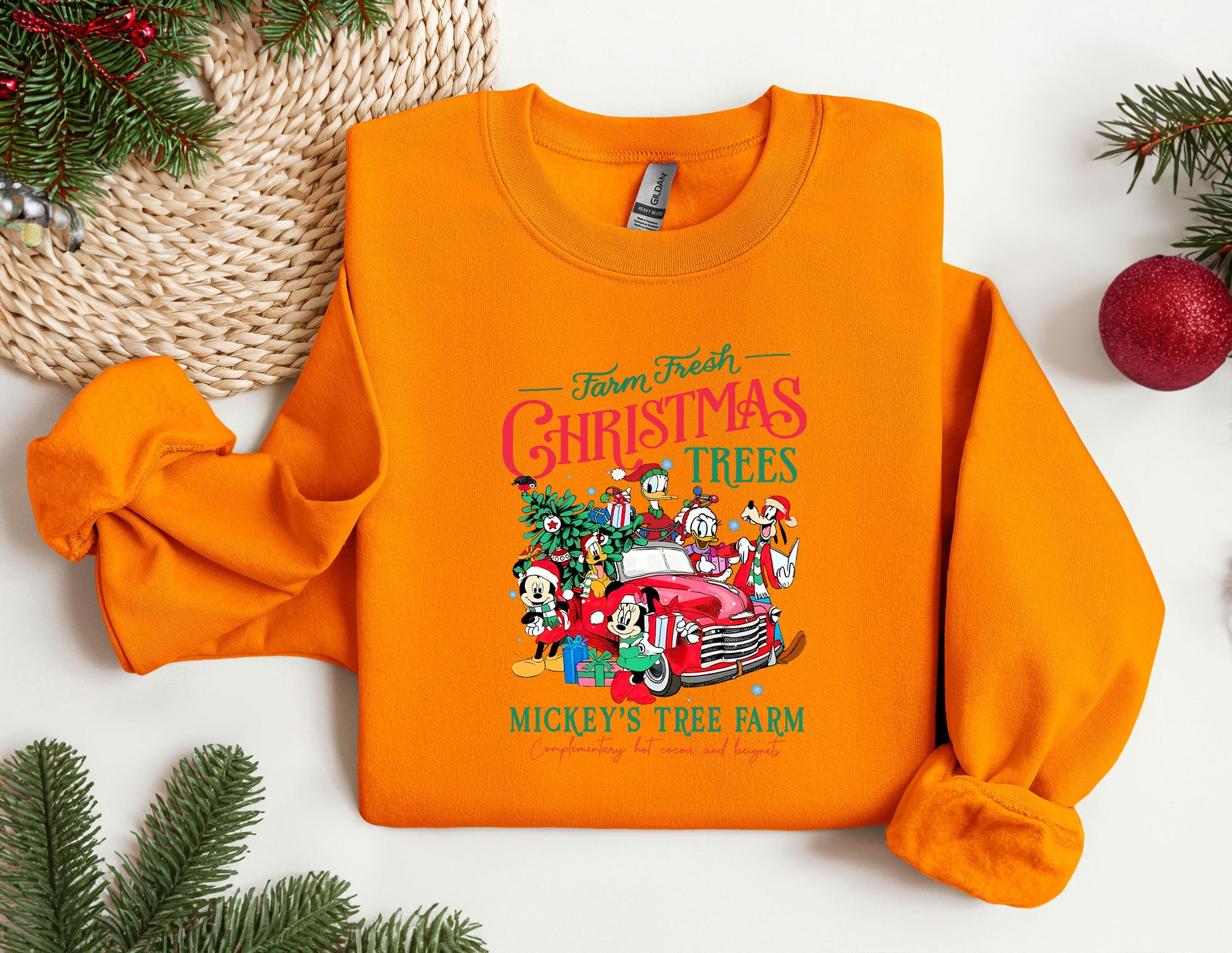 an orange shirt with a christmas tree on it