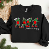 a black sweater with a group of elves on it