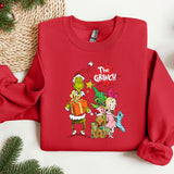 a red sweatshirt with the grinch characters on it